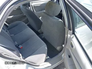 2002 Toyota Corolla CE with VIN 1NXBR12E12Z581660, listed as a IAAI auction lot 42654124 with 115,950 mi miles and . Bid and sale history available at DreamBid. Image 8.