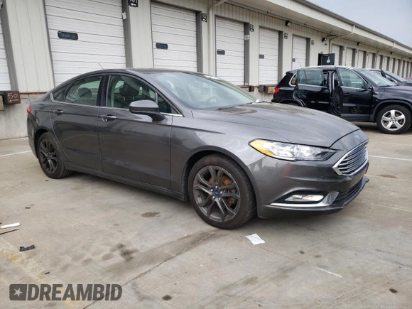 2018 Ford Fusion SE z VIN 3FA6P0HD8JR245391, wystawiony jako Copart lot #53571445 z przebiegiem 158 138 mil mil oraz Czysty tytuł • Clean title. Historia ofert i sprzedaży dostępna na DreamBid. Obrazek 4.