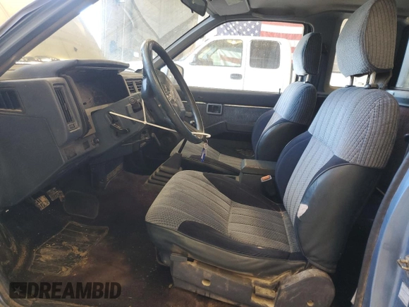 1989 Nissan Hardbody z VIN 1N6HD16S3KC401756, wystawiony jako Copart lot #46811635 z przebiegiem 78 698 mil mil oraz Szkoda całkowita • Salvage title. Historia ofert i sprzedaży dostępna na DreamBid. Obrazek 7.