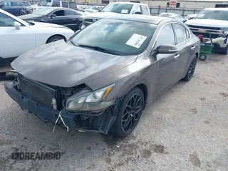 2014 Nissan Maxima SV with VIN 1N4AA5AP2EC447824, listed as a IAAI auction lot 42481206 with 157,540 mi miles and . Bid and sale history available at DreamBid. Image 2.