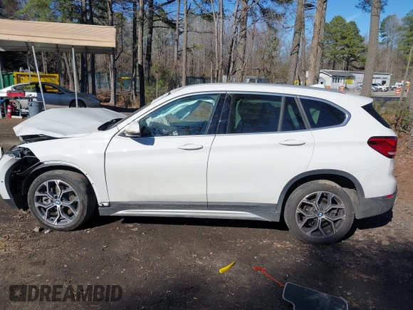 2022 BMW X1 xDrive28i z VIN WBXJG9C04N5V16794, wystawiony jako IAAI lot #41667535 z przebiegiem 55 747 mil mil oraz . Historia ofert i sprzedaży dostępna na DreamBid. Obrazek 14.