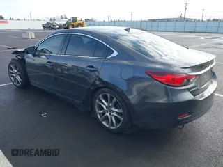 2014 Mazda 6 i Grand Touring with VIN JM1GJ1W63E1147380, listed as a IAAI auction lot 41928637 with 140,091 mi miles and . Bid and sale history available at DreamBid. Image 3.