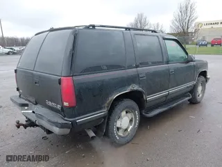 1999 Chevrolet Tahoe Z71 with VIN 1GNEK13R9XJ515820, listed as a IAAI auction lot 42004125 with 251,184 mi miles. Bid and sale history available at carsss.com. Image 4.