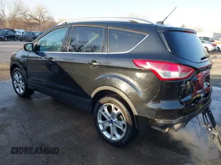 2014 Ford Escape Titanium with VIN 1FMCU0JX0EUC21512, listed as a IAAI auction lot 41781026 with 142,771 mi miles. Bid and sale history available at carsss.com. Image 3.
