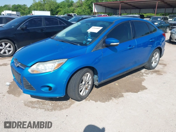2014 Ford Focus SE with VIN 1FADP3F29EL122925, listed as a IAAI auction lot 42044004 with 216,490 mi miles. Bid and sale history available at carsss.com. Image 2.
