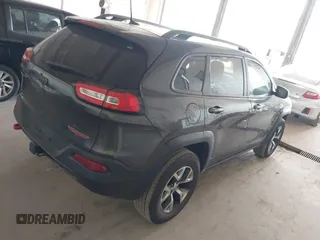 2016 Jeep Cherokee Trailhawk with VIN 1C4PJMBS0GW169184, listed as a IAAI auction lot 42255346 with 152,802 mi miles and . Bid and sale history available at DreamBid. Image 4.