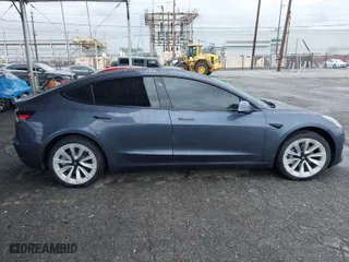 2021 Tesla Model 3 Long Range with VIN 5YJ3E1EB8MF936695, listed as a IAAI auction lot 41778553 with 50,732 mi miles. Bid and sale history available at carsss.com. Image 12.