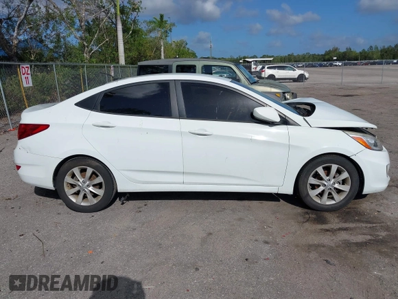 2014 Hyundai Accent GLS with VIN KMHCU4AE8EU608539, listed as a IAAI auction lot 41946784 with 106,709 mi miles and . Bid and sale history available at carsss.com. Image 12.