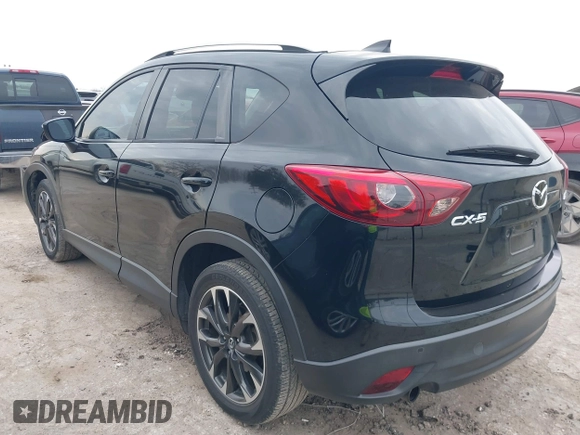 2016 Mazda CX-5 Grand Touring with VIN JM3KE2DY0G0651300, listed as a IAAI auction lot 41678833 with 98,790 mi miles. Bid and sale history available at carsss.com. Image 3.