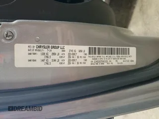 2014 Dodge Grand Caravan American Value with VIN 2C4RDGBG7ER451633, listed as a Copart auction lot 55100195 with 196,821 mi miles and Clean Title. Bid and sale history available at DreamBid. Image 13.