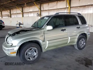 1999 Suzuki Grand Vitara LX z VIN JS3TD62V3X4123048, wystawiony jako Copart lot #73007124 z przebiegiem 159 828 mil mil oraz Szkoda całkowita • Salvage title. Historia ofert i sprzedaży dostępna na DreamBid. Obrazek 1.