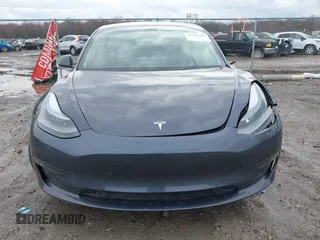 2022 Tesla Model 3 Long Range with VIN 5YJ3E1EB8NF201023, listed as a IAAI auction lot 41942943 with 30,635 mi miles and . Bid and sale history available at DreamBid. Image 11.