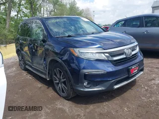 2019 Honda Pilot Touring 7-Passenger z VIN 5FNYF6H63KB000365, wystawiony jako IAAI lot #42154822 z przebiegiem 238 032 mil mil oraz . Historia ofert i sprzedaży dostępna na DreamBid. Obrazek 1.