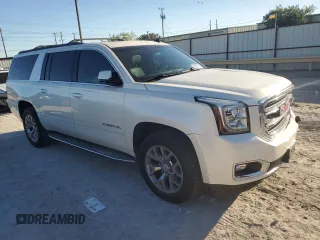 2015 GMC Yukon XL SLT with VIN 1GKS1HKC6FR166415, listed as a Copart auction lot 73029014 with 105,209 mi miles and Salvage Title. Bid and sale history available at carsss.com. Image 4.