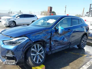 2022 BMW X2 xDrive28i z VIN WBXYJ1C02N5U85241, wystawiony jako IAAI lot #41965012 z przebiegiem 36 262 mil mil oraz . Historia ofert i sprzedaży dostępna na DreamBid. Obrazek 6.