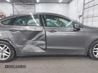 2015 Ford Fusion SE z VIN 3FA6P0HD0FR132316, wystawiony jako IAAI lot #41770636 z przebiegiem 185 681 mil mil oraz . Historia ofert i sprzedaży dostępna na DreamBid. Obrazek 13.