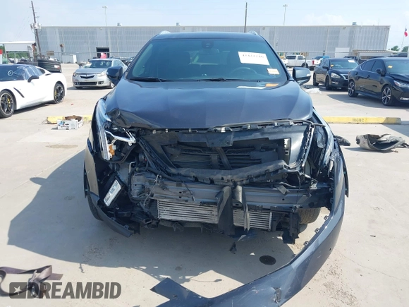 2023 Cadillac XT5 FWD Luxury с VIN 1GYKNAR40PZ193854, выставлен на аукционе IAAI как лот 42422246 с пробегом 26 053 миль миль и . История ставок и продаж доступна на DreamBid. Изображение 13.