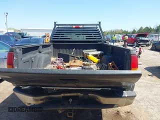 1999 Chevrolet Silverado 2500 LS z VIN 1GCGC29U0XE197465, wystawiony jako IAAI lot #41982958 z przebiegiem Nie podano mil oraz . Historia ofert i sprzedaży dostępna na DreamBid. Obrazek 16.