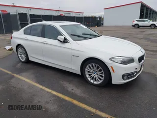2015 BMW 5 Series 528i with VIN WBA5A5C5XFD516999, listed as a IAAI auction lot 41195184 with 131,187 mi miles. Bid and sale history available at carsss.com. Image 1.