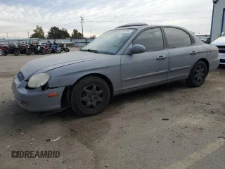 2001 Hyundai Sonata GLS with VIN KMHWF35VX1A372516, listed as a Copart auction lot 76357494 with 170,642 mi miles and Salvage Title. Bid and sale history available at carsss.com. Image 1.