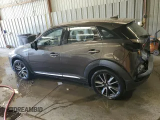 2016 Mazda CX-3 Grand Touring z VIN JM1DKFD74G0137815, wystawiony jako Copart lot #52405765 z przebiegiem 128 922 mil mil oraz Szkoda całkowita • Salvage title. Historia ofert i sprzedaży dostępna na DreamBid. Obrazek 2.
