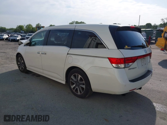 2014 Honda Odyssey Touring with VIN 5FNRL5H94EB001479, listed as a IAAI auction lot 41123678 with 147,269 mi miles and . Bid and sale history available at carsss.com. Image 3.