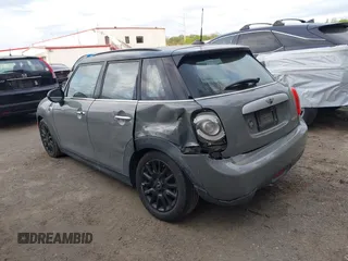 2015 MINI Hardtop 4 Door with VIN WMWXS5C57FT831660, listed as a IAAI auction lot 42057682 with 110,940 mi miles and . Bid and sale history available at DreamBid. Image 3.