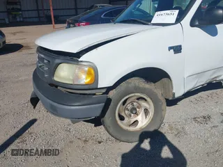 2003 Ford F-150 XL with VIN 2FTRF17W03CA59388, listed as a IAAI auction lot 41673651 with 221,668 mi miles. Bid and sale history available at carsss.com. Image 14.