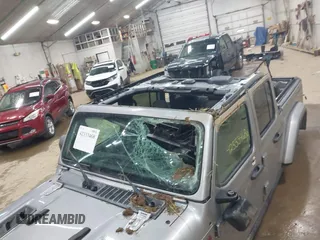2020 Jeep Gladiator Rubicon with VIN 1C6JJTBGXLL136627, listed as a IAAI auction lot 42333468 with 74,717 mi miles and . Bid and sale history available at DreamBid. Image 6.