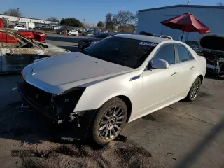 2012 Cadillac CTS with VIN 1G6DC5E57C0156215, listed as a Copart auction lot 42979835 with 105,301 mi miles and Salvage Title. Bid and sale history available at DreamBid. Image 1.