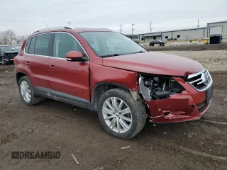 2011 Volkswagen Tiguan SE with VIN WVGBV7AXXBW001845, listed as a Copart auction lot 52414935 with 256,311 mi miles and Salvage Title. Bid and sale history available at DreamBid. Image 4.