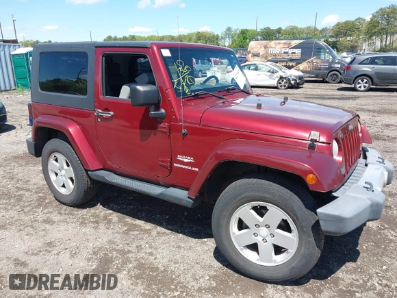 2010 Jeep Wrangler Sahara z VIN 1J4GA5D16AL227053, wystawiony jako IAAI lot #42219421 z przebiegiem 67 174 mil mil oraz . Historia ofert i sprzedaży dostępna na DreamBid. Obrazek 1.