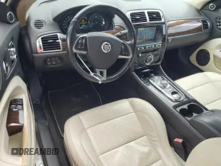 2013 Jaguar XK with VIN SAJWA4FB3DLB50331, listed as a Copart auction lot 66573384 with 109,887 mi miles and Salvage Title. Bid and sale history available at carsss.com. Image 8.