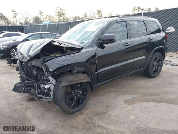 2019 Jeep Grand Cherokee Laredo E with VIN 1C4RJEAGXKC571770, listed as a IAAI auction lot 41677487 with 113,089 mi miles. Bid and sale history available at carsss.com. Image 2.