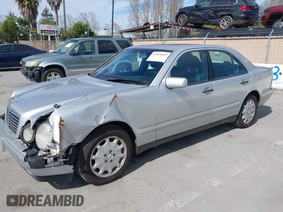 1998 Mercedes-Benz E-Class with VIN WDBJF65F5WA702626, listed as a IAAI auction lot 42014815 with 113,632 mi miles. Bid and sale history available at carsss.com. Image 2.