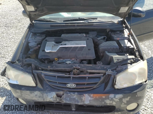 2004 Kia Spectra LX with VIN KNAFE121X45021922, listed as a Copart auction lot 49989845 with 184,189 mi miles and Salvage Title. Bid and sale history available at carsss.com. Image 13.