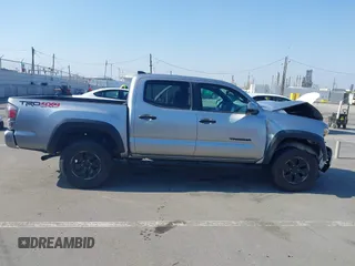2021 Toyota Tacoma SR with VIN 5TFCZ5AN6MX270972, listed as a IAAI auction lot 42460823 with 76,062 mi miles and . Bid and sale history available at DreamBid. Image 14.