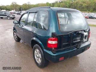 2000 Kia Sportage with VIN KNDJA7233Y5685000, listed as a IAAI auction lot 42005169 with 221,447 mi miles. Bid and sale history available at carsss.com. Image 3.