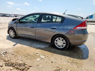 2010 Honda Insight LX with VIN JHMZE2H52AS043392, listed as a Copart auction lot 61347625 with 194,248 mi miles and Salvage title. Bid and sale history available at DreamBid. Image 2.