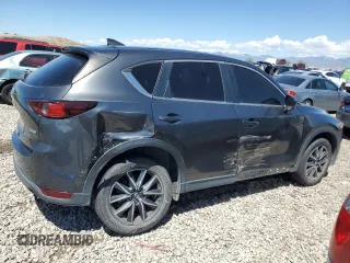 2018 Mazda CX-5 Touring z VIN JM3KFACM5J0338126, wystawiony jako Copart lot #56185795 z przebiegiem 115 254 mil mil oraz Szkoda całkowita • Salvage title. Historia ofert i sprzedaży dostępna na DreamBid. Obrazek 3.