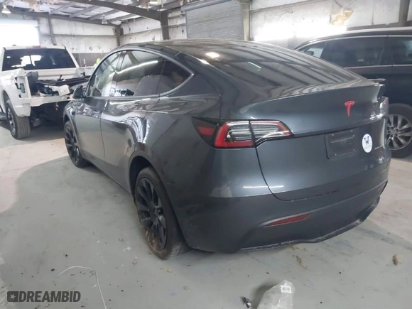 2023 Tesla Model Y Long Range with VIN 7SAYGDEE3PA034830, listed as a IAAI auction lot 41351397 with 26,704 mi miles. Bid and sale history available at carsss.com. Image 3.