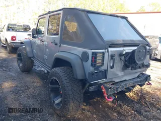 2015 Jeep Wrangler Unlimited Rubicon Hard Rock with VIN 1C4HJWFG1FL777222, listed as a IAAI auction lot 41843893 with 74,718 mi miles and . Bid and sale history available at DreamBid. Image 3.
