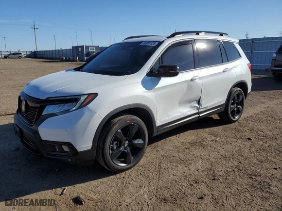 2021 Honda Passport Elite with VIN 5FNYF8H05MB039064, listed as a Copart auction lot 88884535 with 23,404 mi miles and Salvage Title. Bid and sale history available at carsss.com. Image 1.