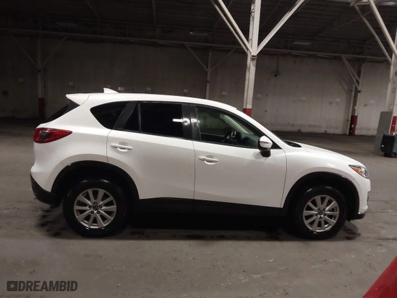 2016 Mazda CX-5 Touring with VIN JM3KE4CY0G0853261, listed as a IAAI auction lot 41861176 with 63,491 mi miles. Bid and sale history available at carsss.com. Image 13.