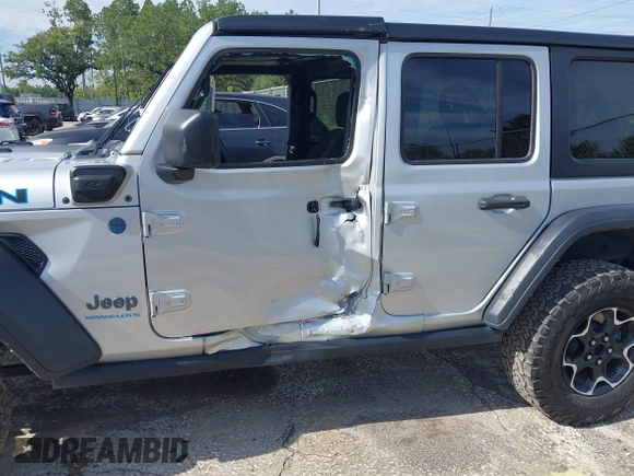 2023 Jeep Wrangler Rubicon with VIN 1C4JJXR63PW703424, listed as a IAAI auction lot 42639653 with 46,412 mi miles and . Bid and sale history available at DreamBid. Image 6.