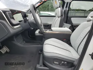 2023 Rivian R1S Adventure z VIN 7PDSGABA6PN017889, wystawiony jako Copart lot #68860864 z przebiegiem 7661 mil mil oraz Szkody całkowita. Historia ofert i sprzedaży dostępna na DreamBid. Obrazek 7.