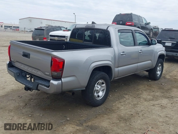 2018 Toyota Tacoma SR with VIN 3TMCZ5AN4JM130307, listed as a IAAI auction lot 41541477 with 74,369 mi miles and . Bid and sale history available at DreamBid. Image 4.