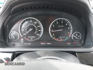 2012 BMW 7 Series 750Li with VIN WBAKB8C50CC963330, listed as a IAAI auction lot 41286275 with 186,335 mi miles. Bid and sale history available at carsss.com. Image 7.