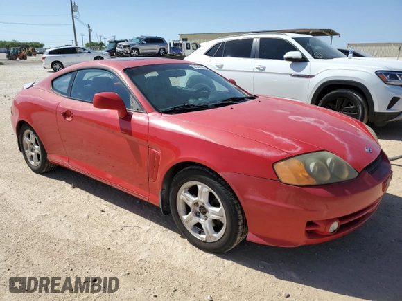 2003 Hyundai Tiburon GT z VIN KMHHN65F53U041351, wystawiony jako Copart lot #52332395 z przebiegiem 194 821 mil mil oraz Czysty tytuł • Clean title. Historia ofert i sprzedaży dostępna na DreamBid. Obrazek 4.