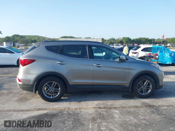 2017 Hyundai Santa Fe 2.4L z VIN 5XYZU3LB0HG420910, wystawiony jako IAAI lot #42017552 z przebiegiem 184 666 mil mil oraz . Historia ofert i sprzedaży dostępna na DreamBid. Obrazek 13.